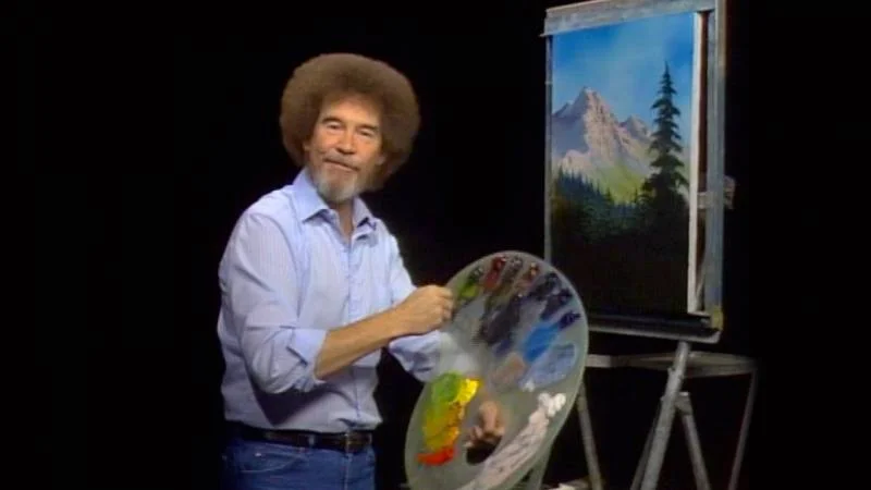 Bob Ross painting a picture